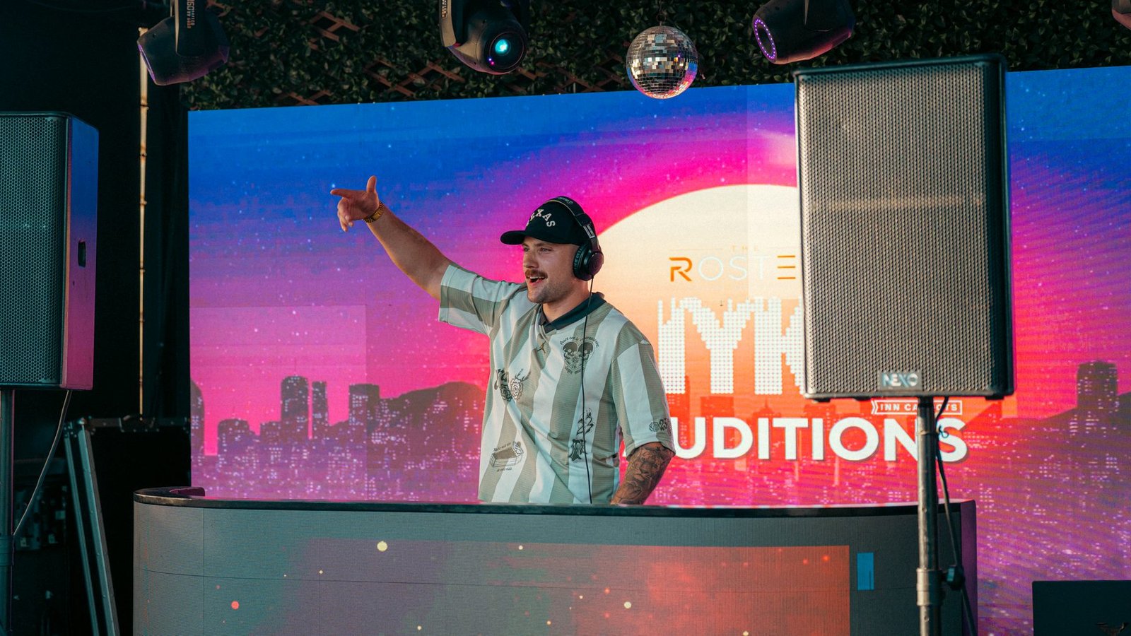 B.Y. behind the decks at the IYKYK live DJ auditions in Austin.